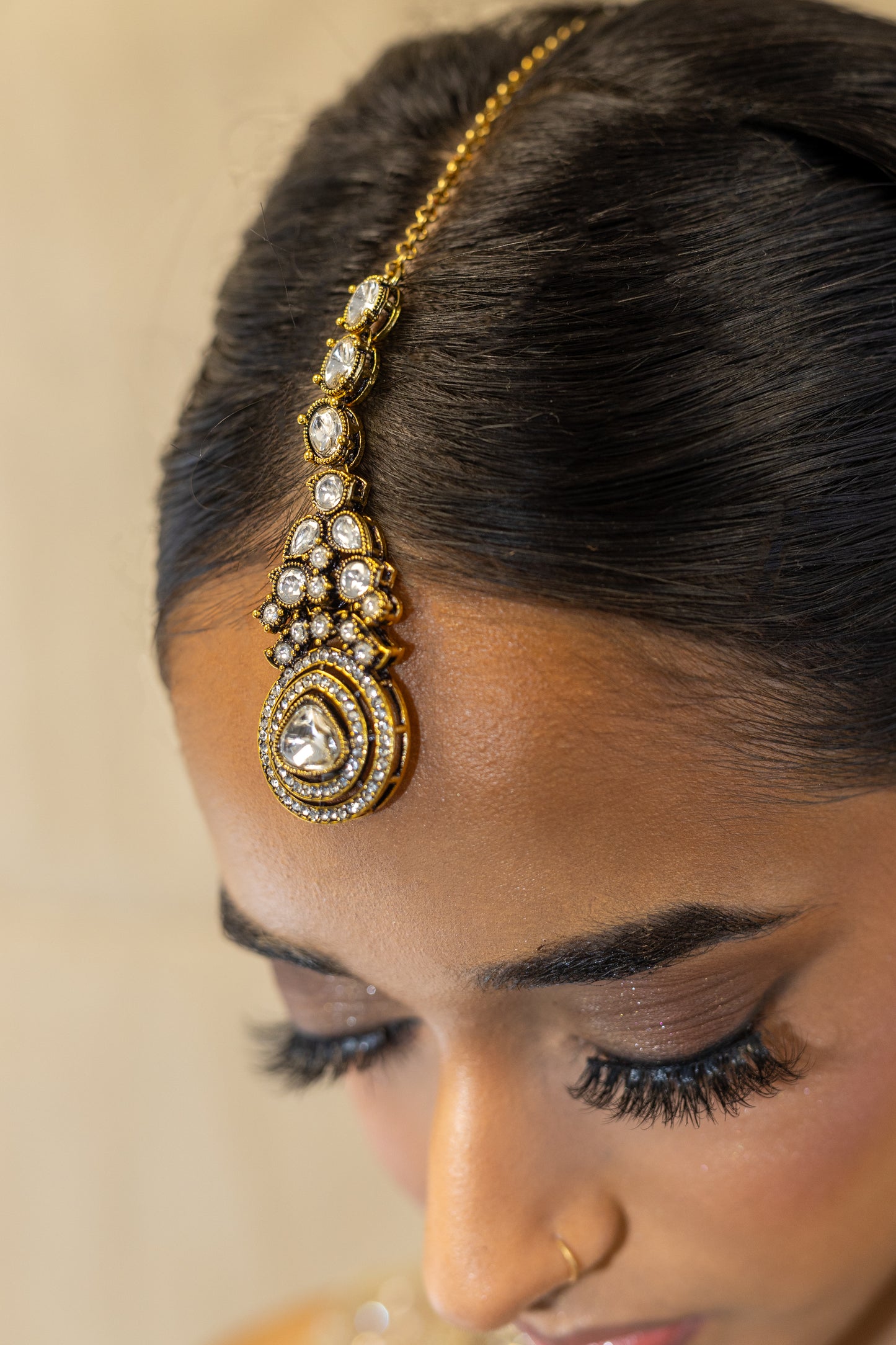 Close-up of Ayra Set Teardrop Kundan Stones and Noble Gold-Tone Finish - Premium South Asian Wedding Jewellery.