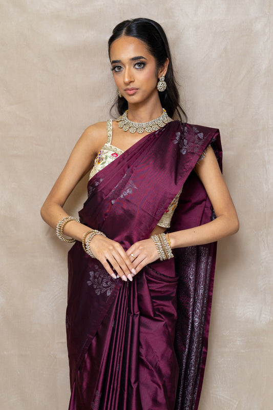 Innaya Kundan Jewellery Set paired with a Wine colour Saree — Classic elegant statement for wedding guests and pre-wedding events.