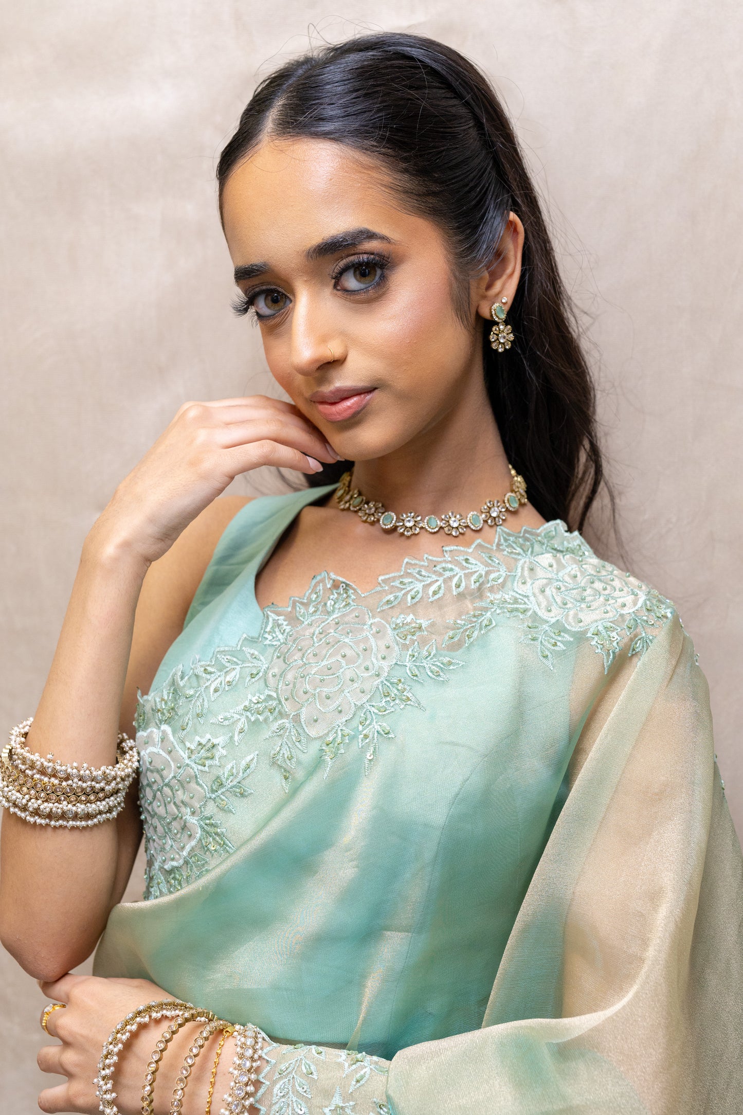 Close-up of Vihana Necklace Floral Crystal Detail and Soft Green Stones - Premium Modern Heirloom.