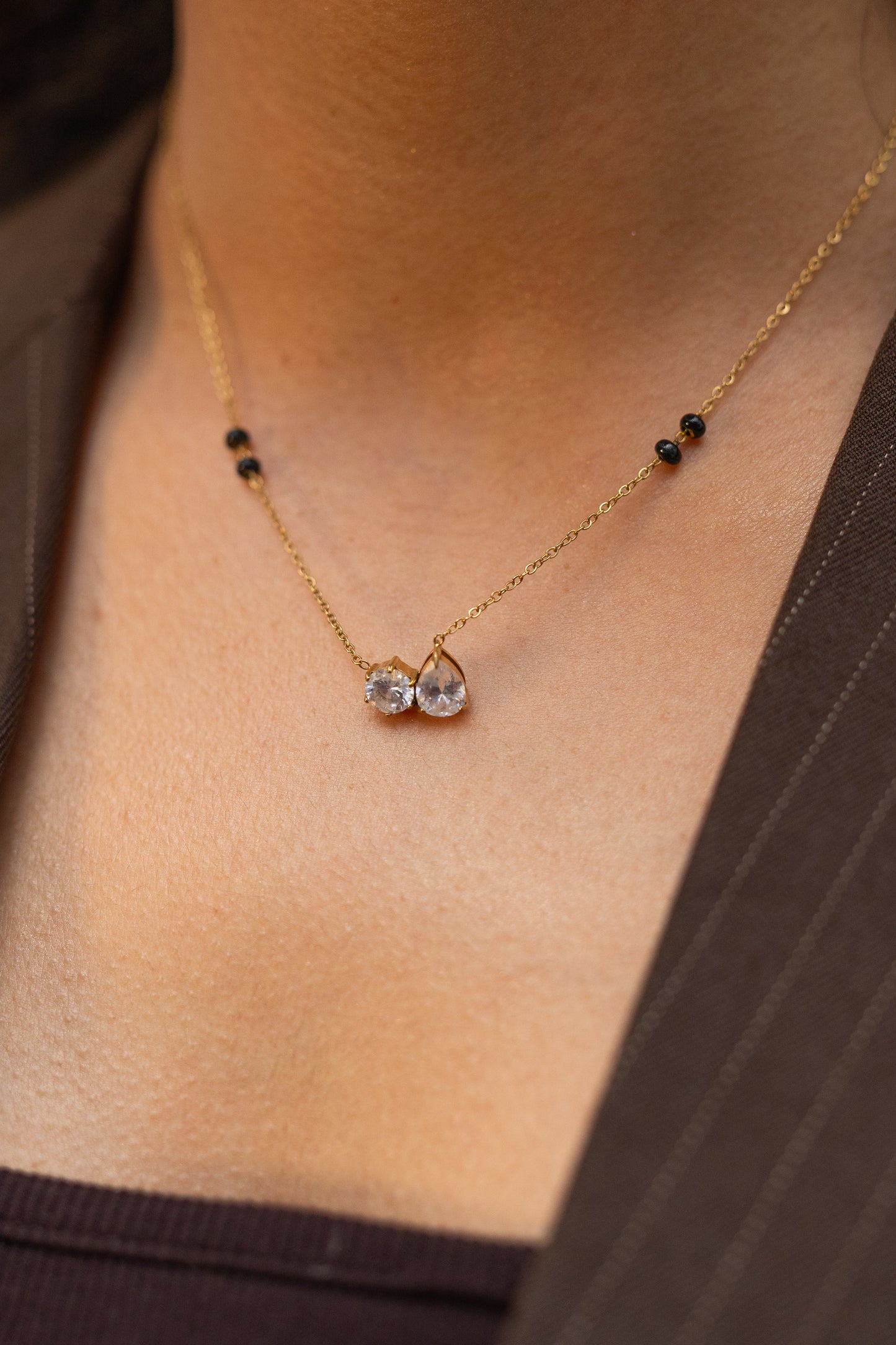 Close-up of Ananta Necklace "Toi et Moi" Crystal Pendant and Black Symbolic Beads - Durable High-Quality Everyday Wear.