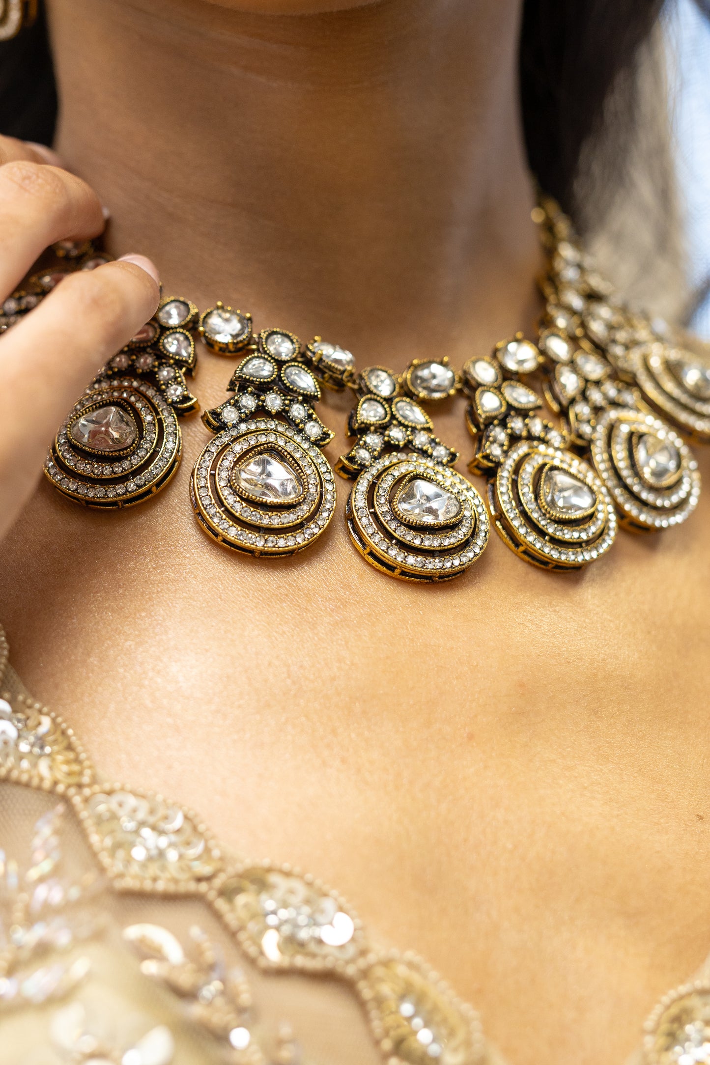 Close-up of Ayra Set Teardrop Kundan Stones and Noble Gold-Tone Finish - Premium South Asian Wedding Jewellery.