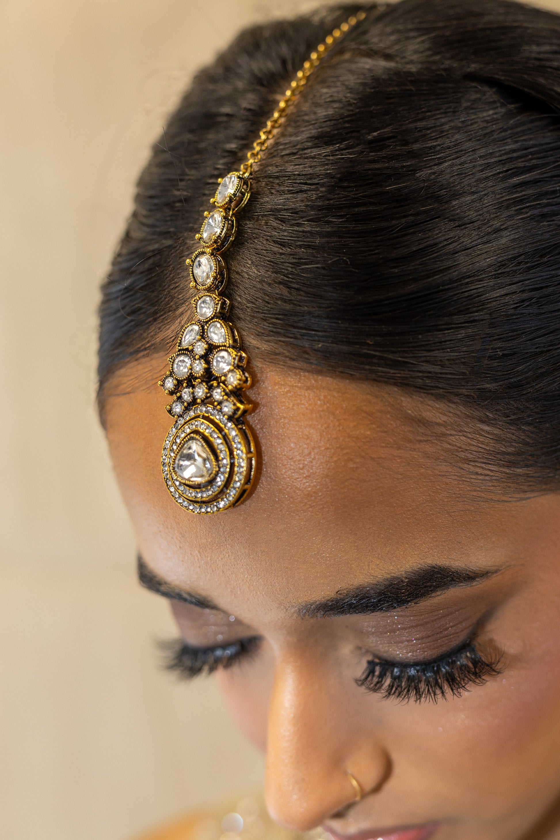 Close-up of Ayra Set Teardrop Kundan Stones and Noble Gold-Tone Finish - Premium South Asian Wedding Jewellery.