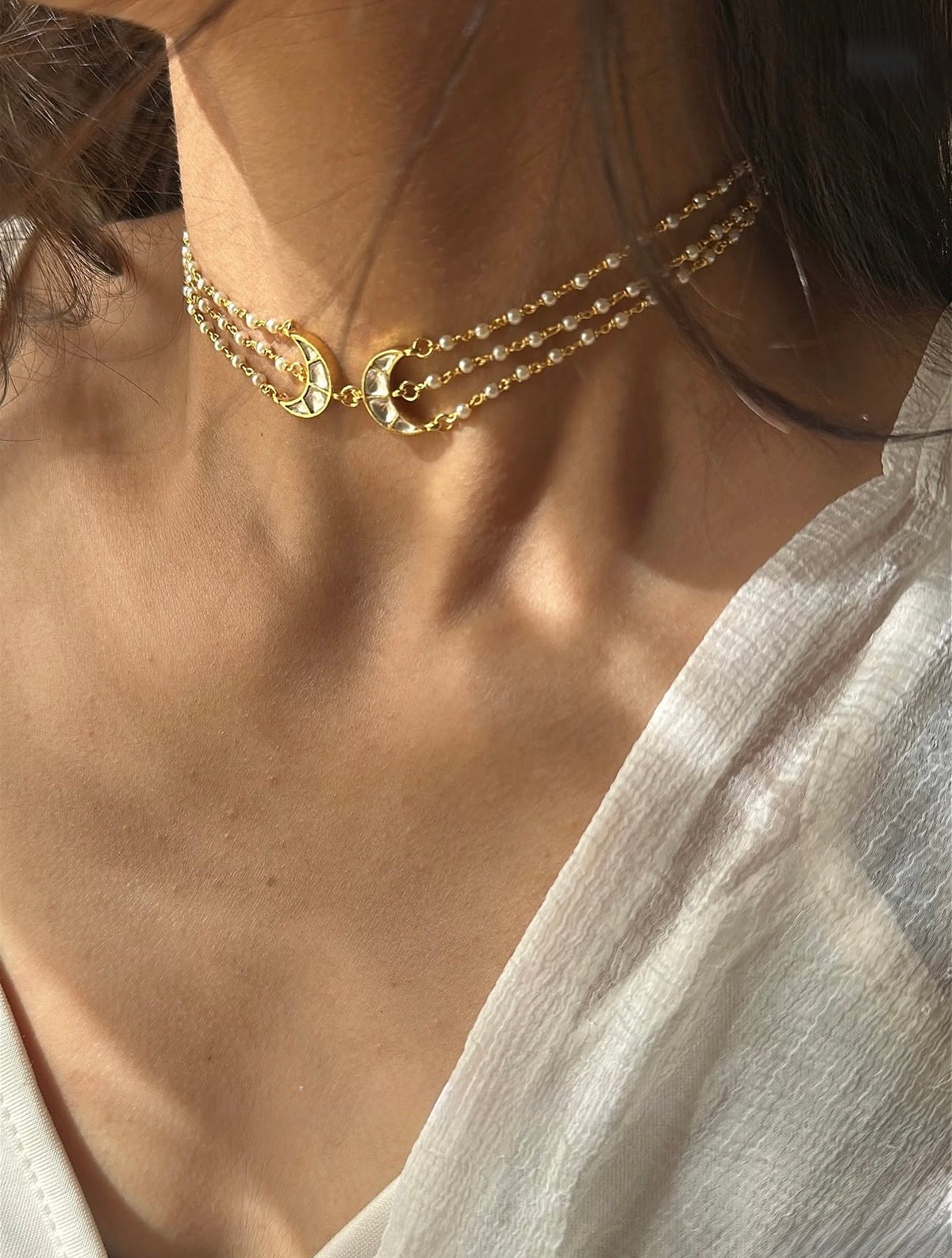 Model wearing the Liyana Set by Kirosa London, featuring a triple-strand pearl Kundan choker.