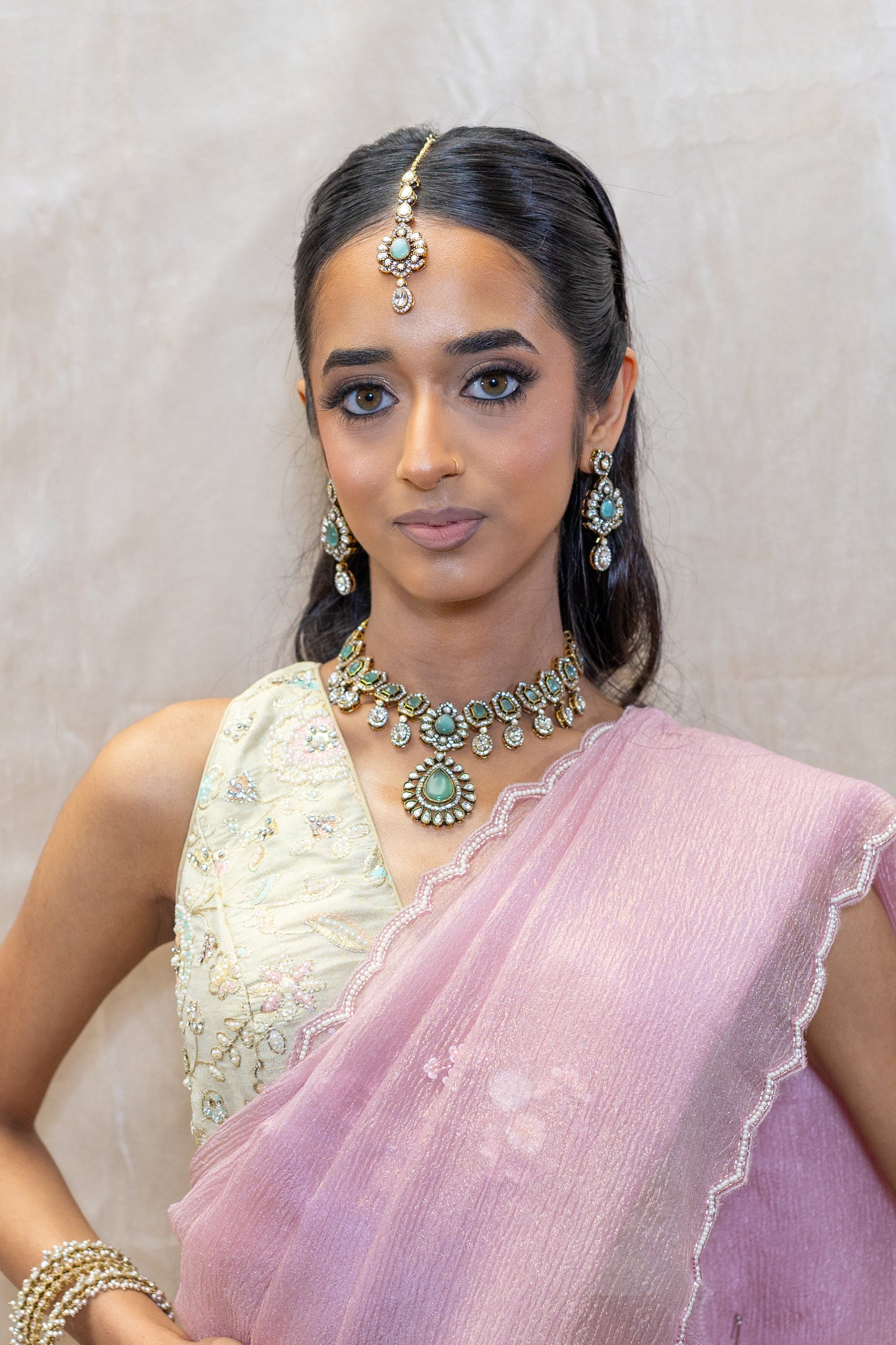 Siyana Mint Aqua Green Kundan Necklace and Tikka Set styled with a Pink Saree – South Asian Bridal Jewellery curated in London.
