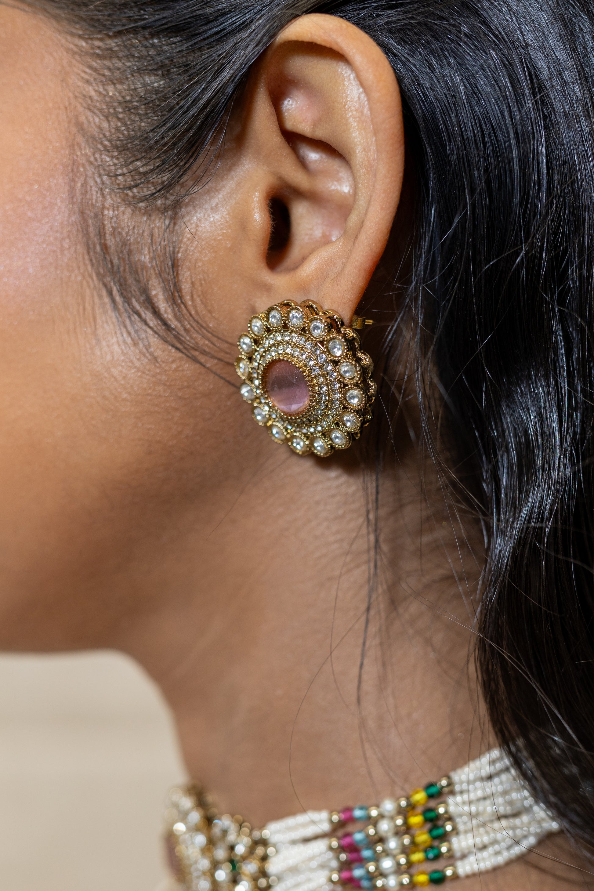 Close-up of Yashvi Choker Pearl Strands and Crystal Pendant - Navratna Inspired Wedding Guest Jewellery.